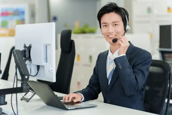 Friendly travel consultant assisting a traveler